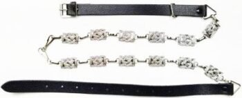 SPORRAN-is-black-leather-with-a-Celtic-cantle-a-white-cowhide-base-on-the-front-over-layed-with-lea